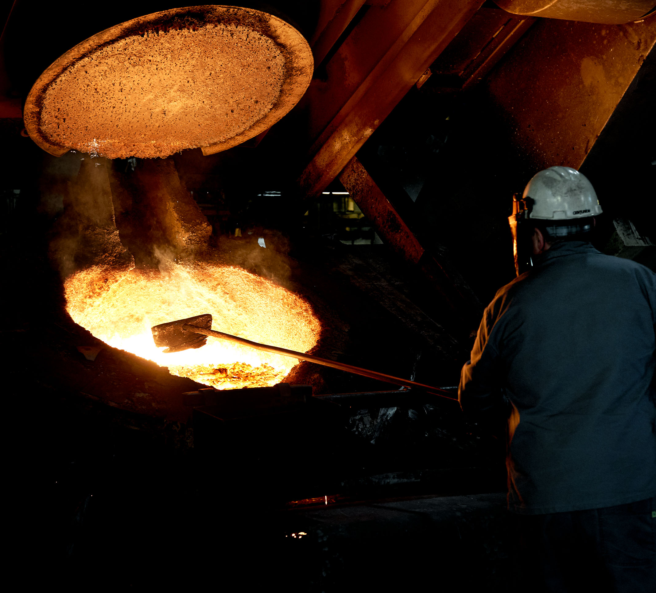 The foundry, molten iron, hands at work